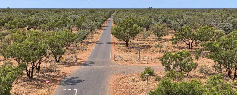 Same outback road near Thargomindah in the dry season, showing the distance remote councils face for IT support all year